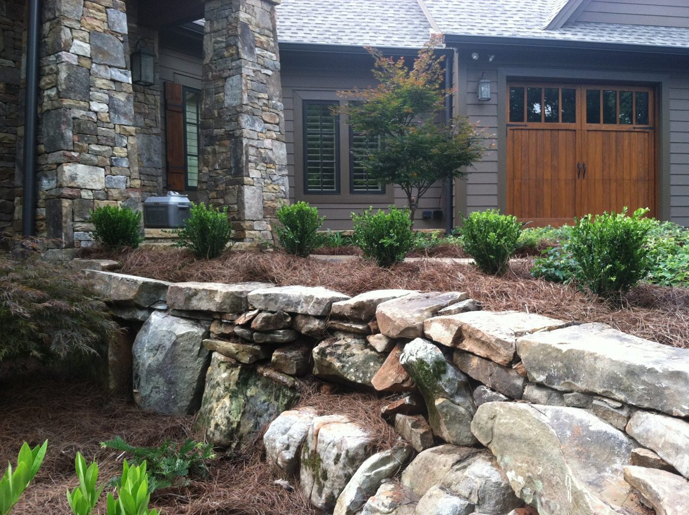 Stone retaining wall and plantings
